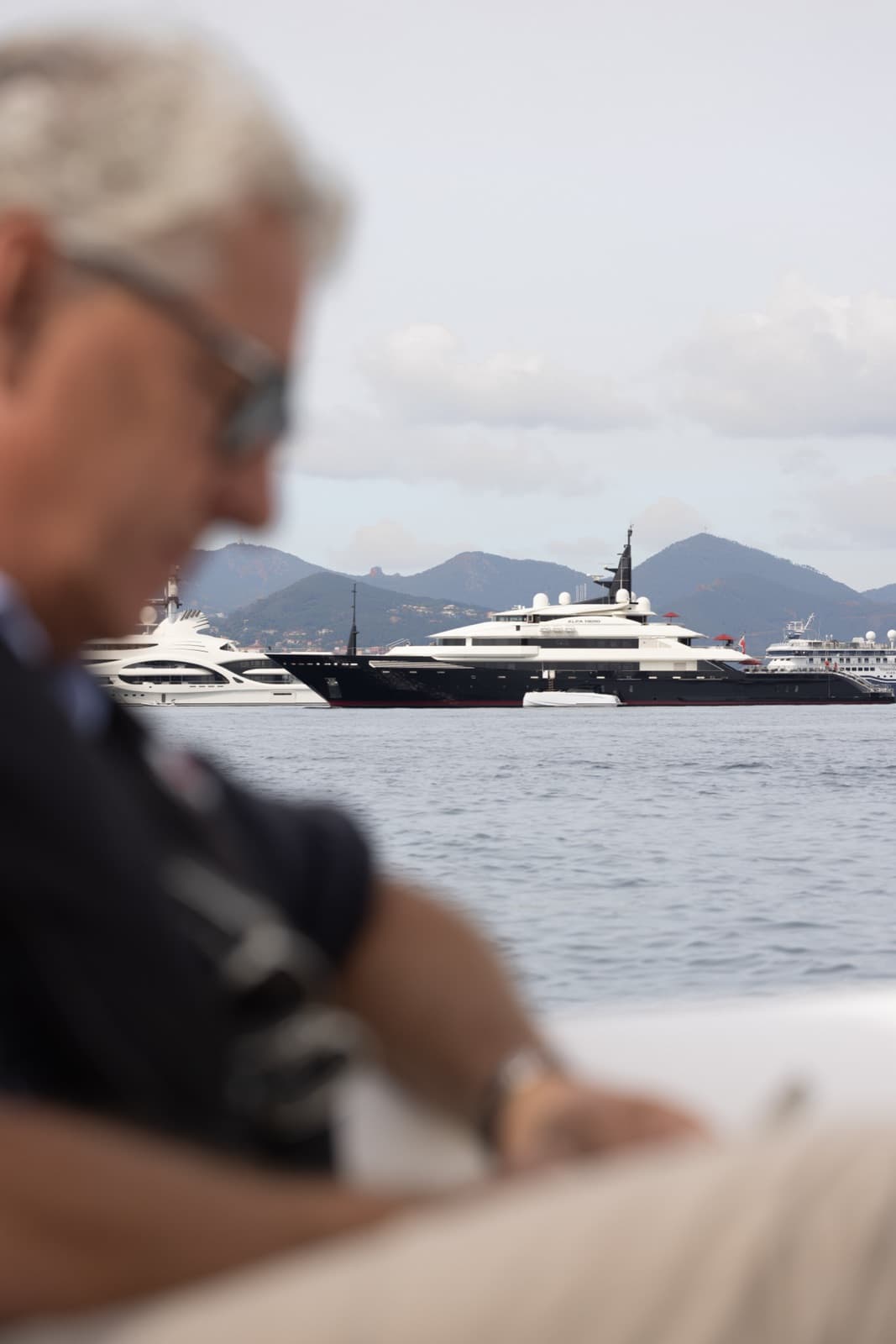 Jan-Jaap Minnema overlooking superyachts at anchor